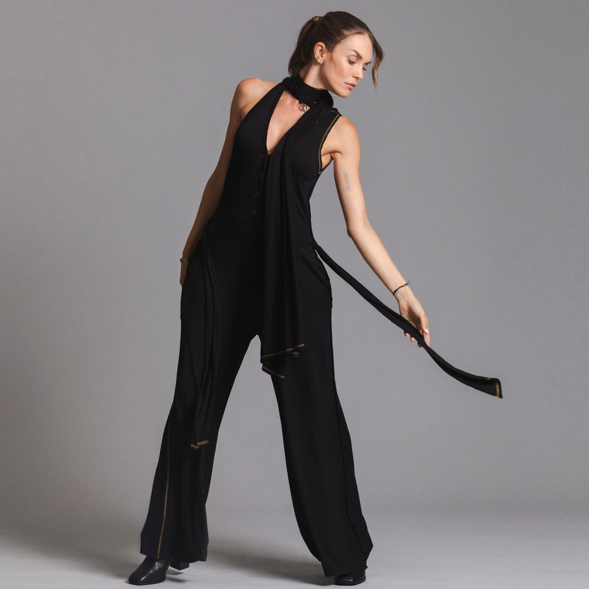 woman modeling the infinite bodysuit in black