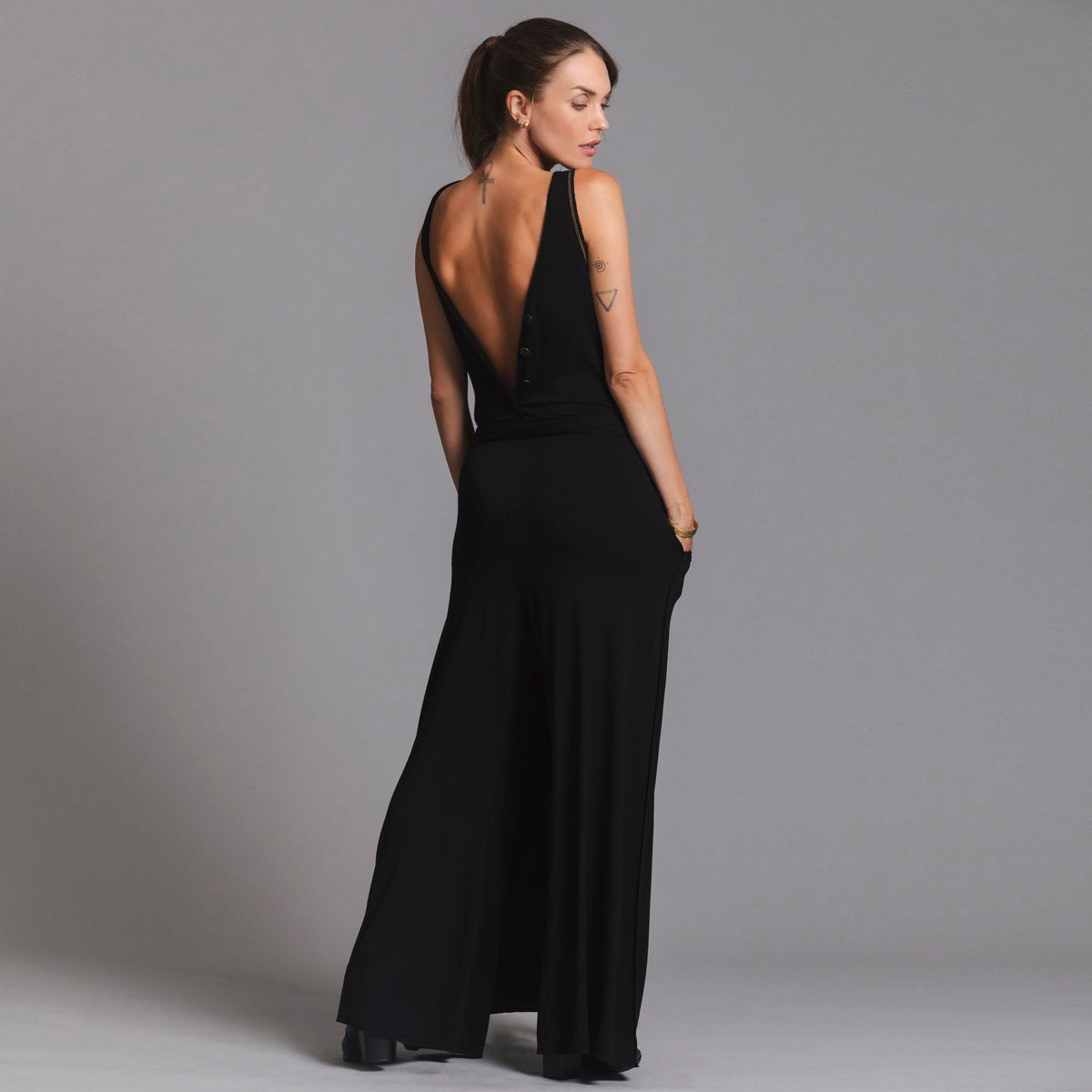 woman modeling the infinite bodysuit in black