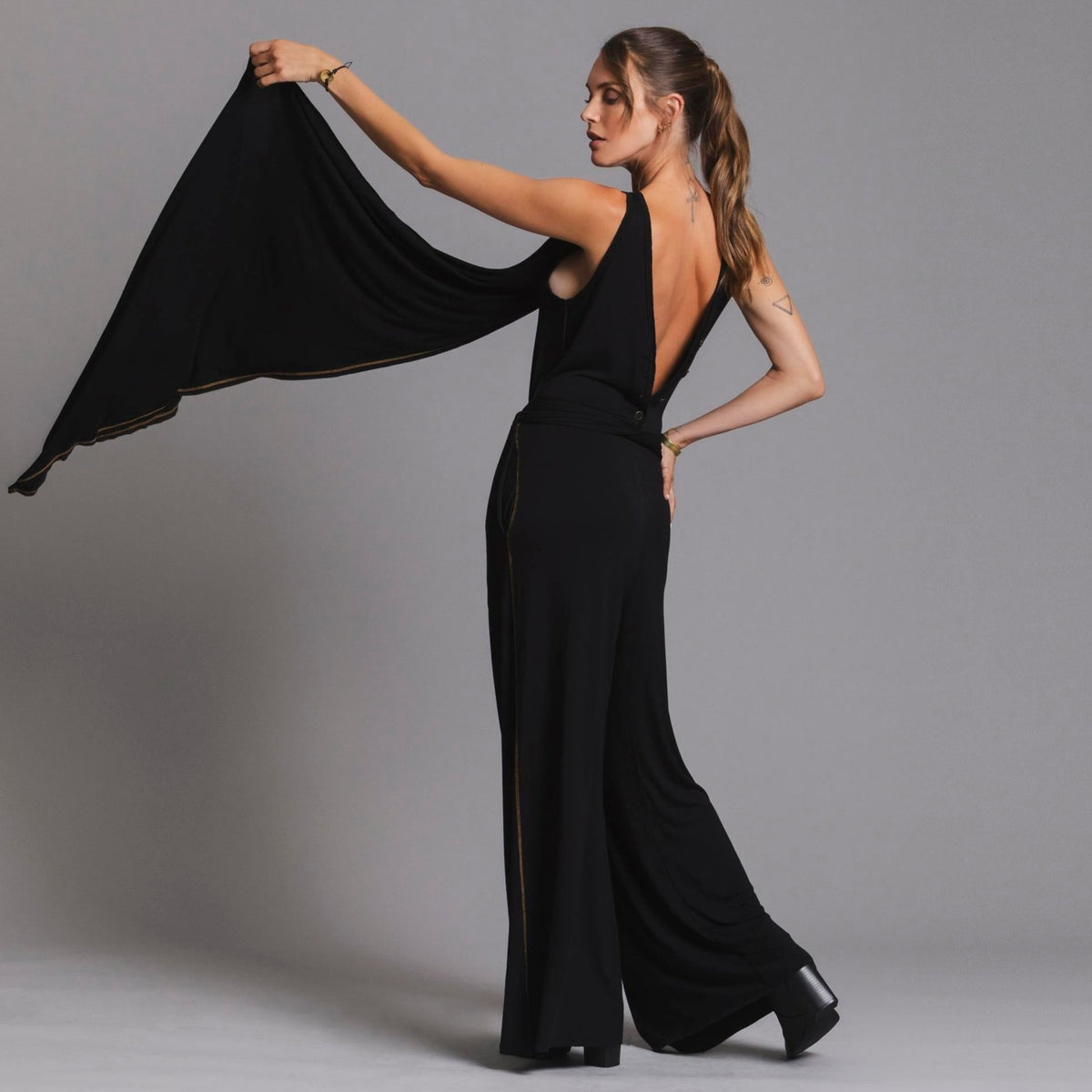 woman modeling the infinite bodysuit in black