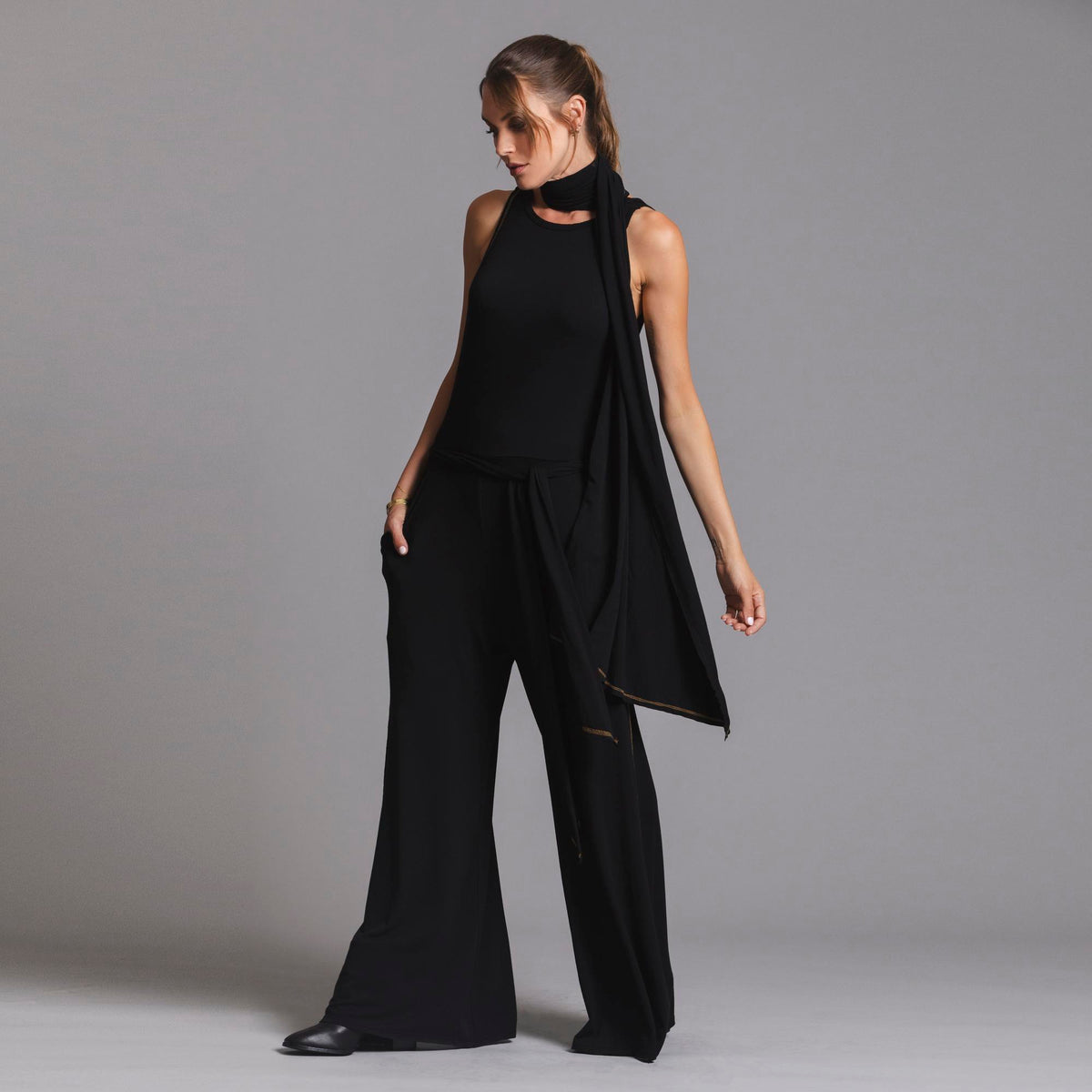 woman modeling the infinite bodysuit in black