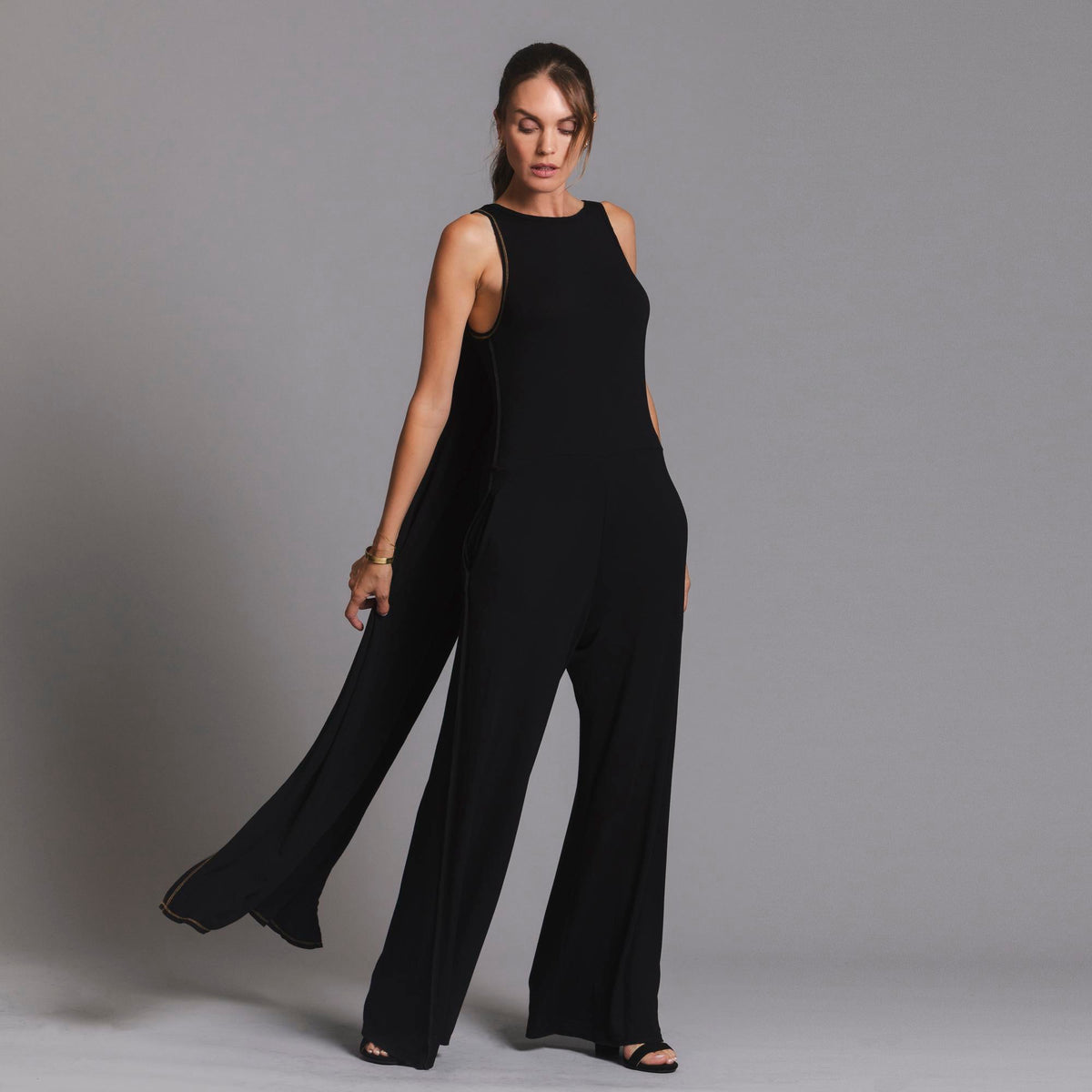 woman modeling the infinite bodysuit in black