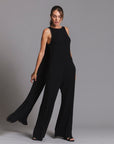 woman modeling the infinite bodysuit in black