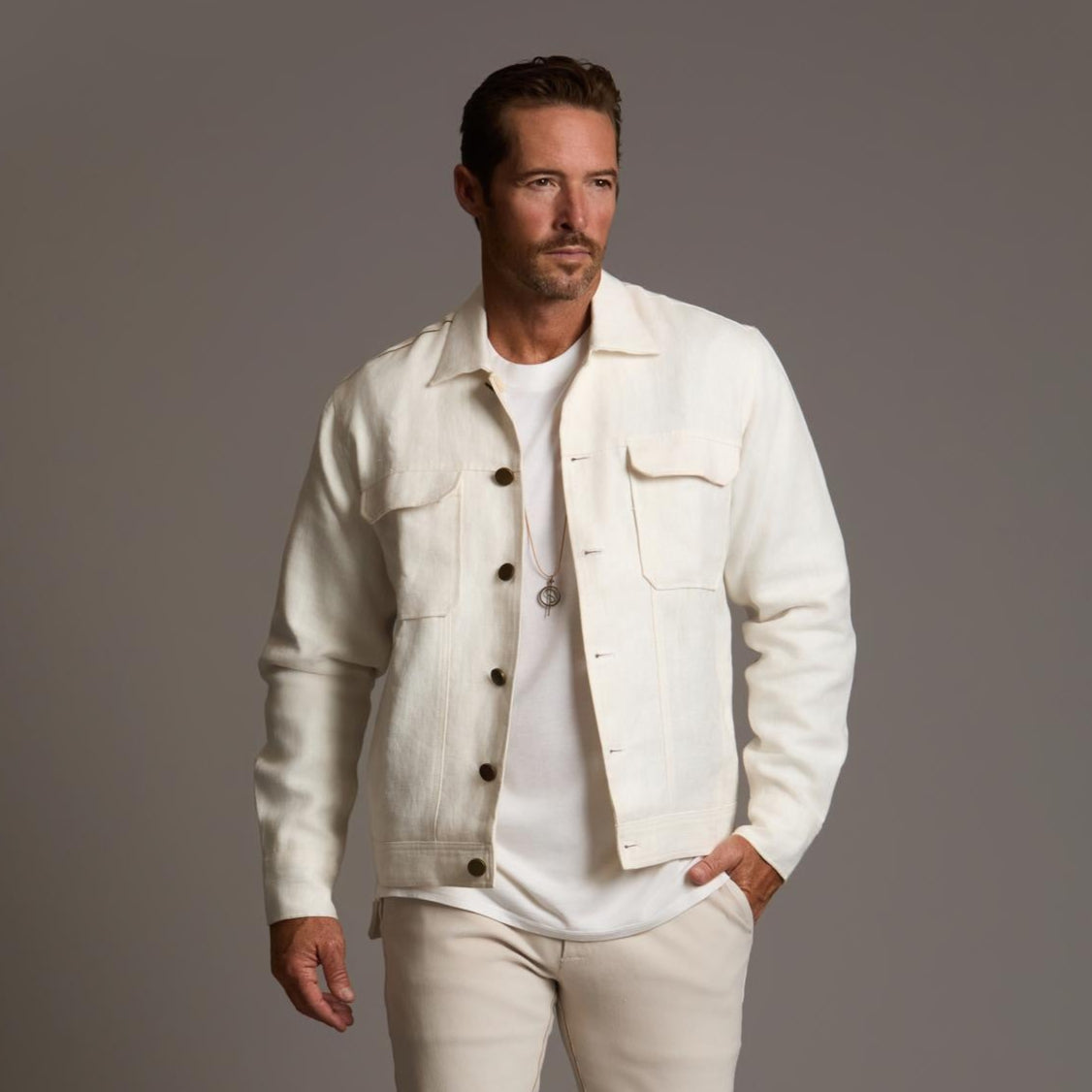 Male modeling white axis jacket