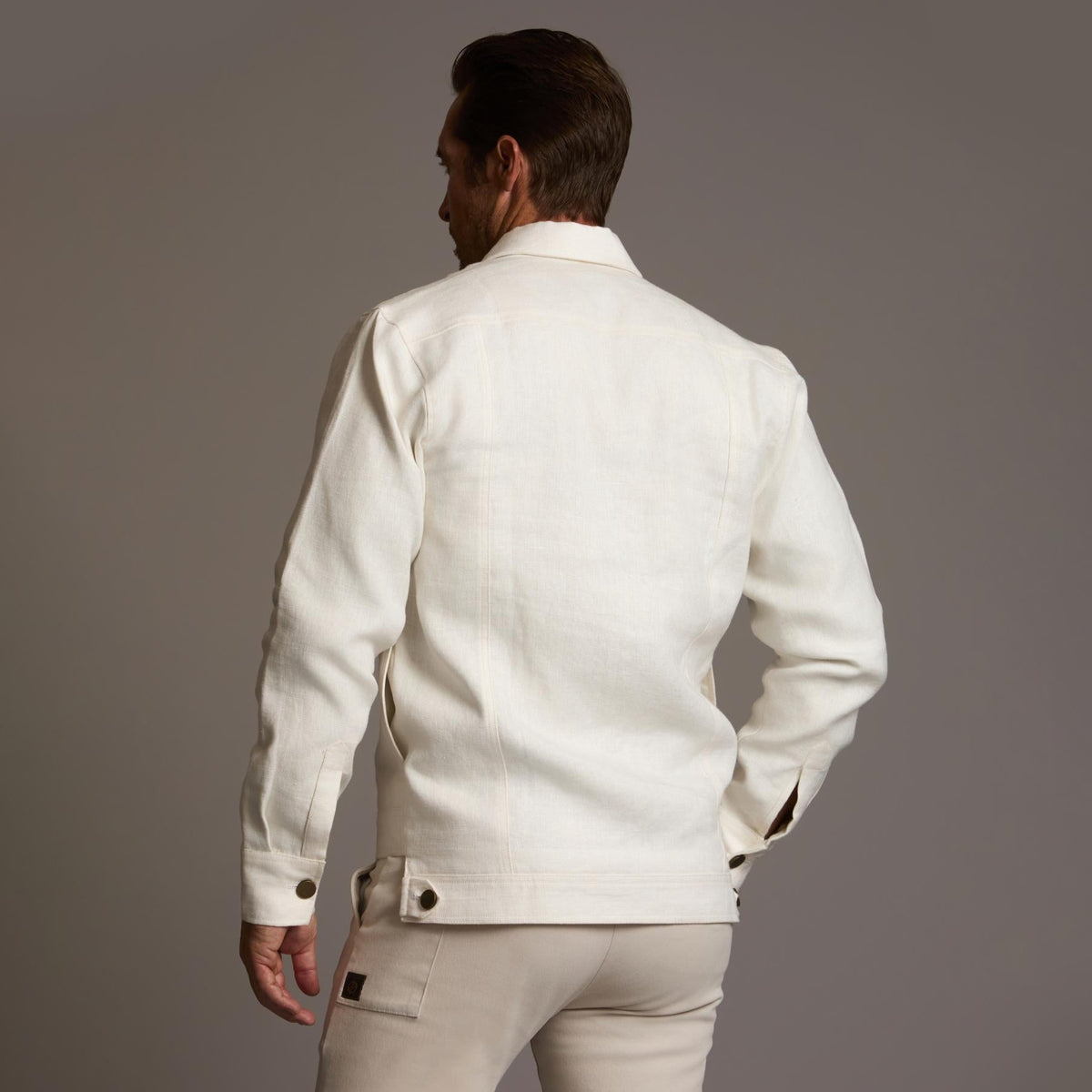 Male modeling white axis jacket