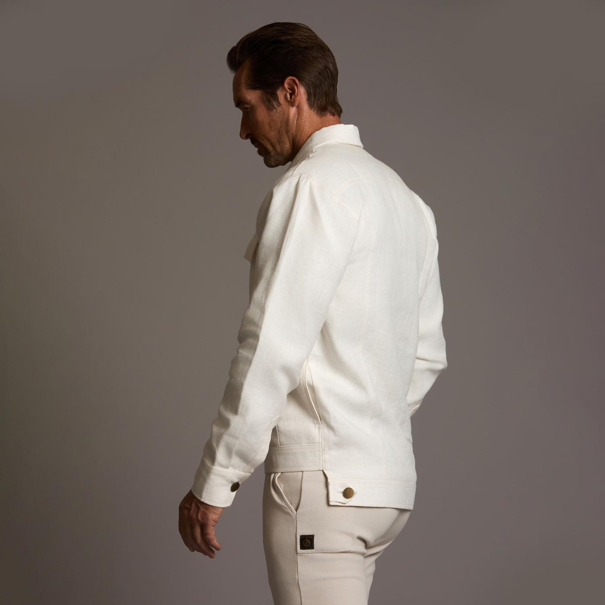 Male modeling white axis jacket