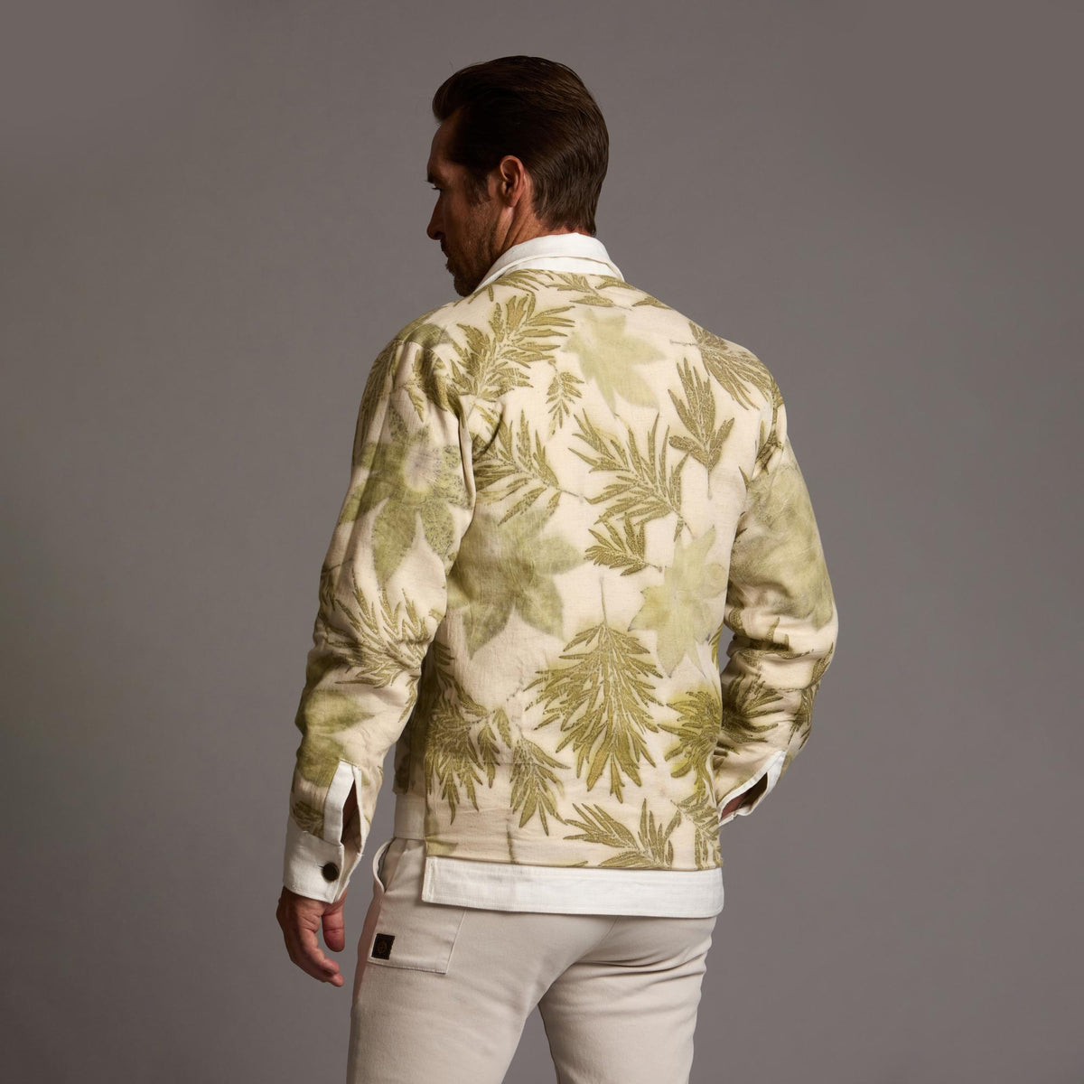 Male modeling white axis jacket