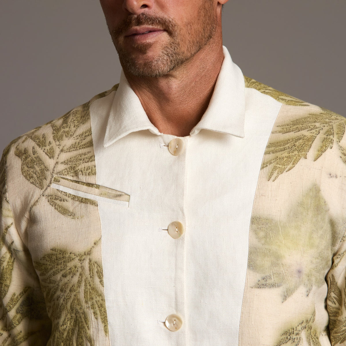 Male modeling white axis jacket
