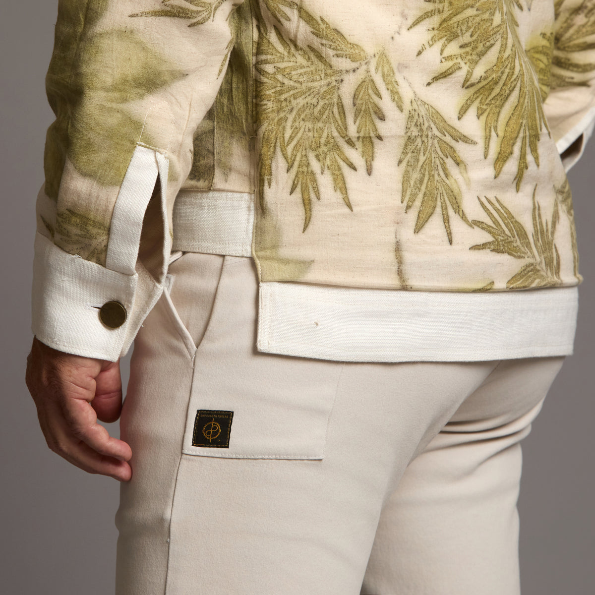 Male modeling white axis jacket
