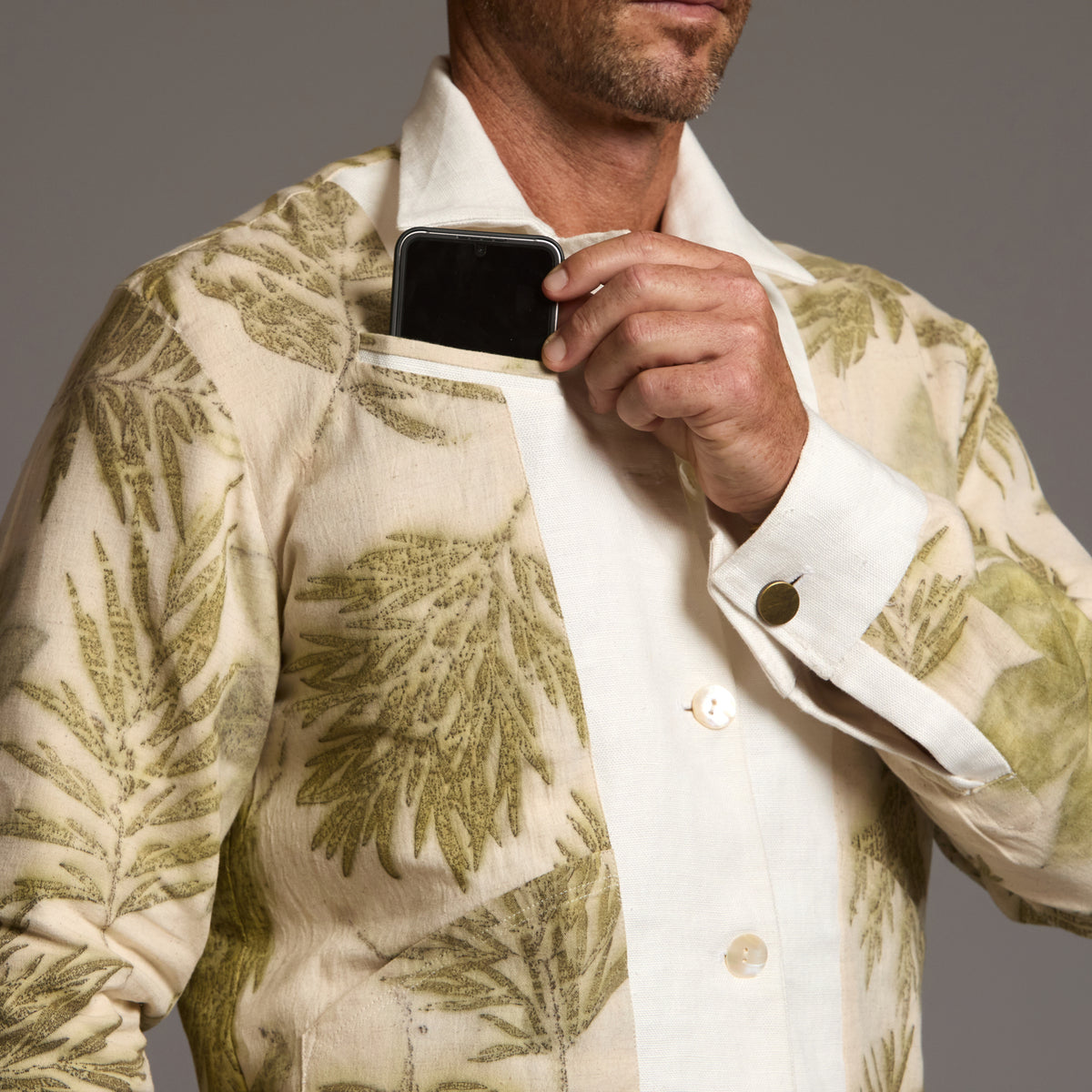 Male modeling white axis jacket
