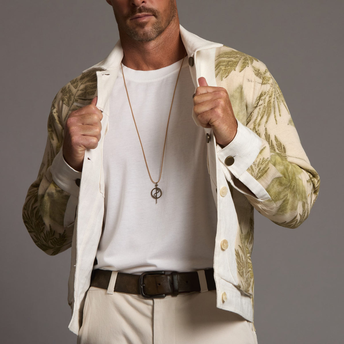 Male modeling white axis jacket