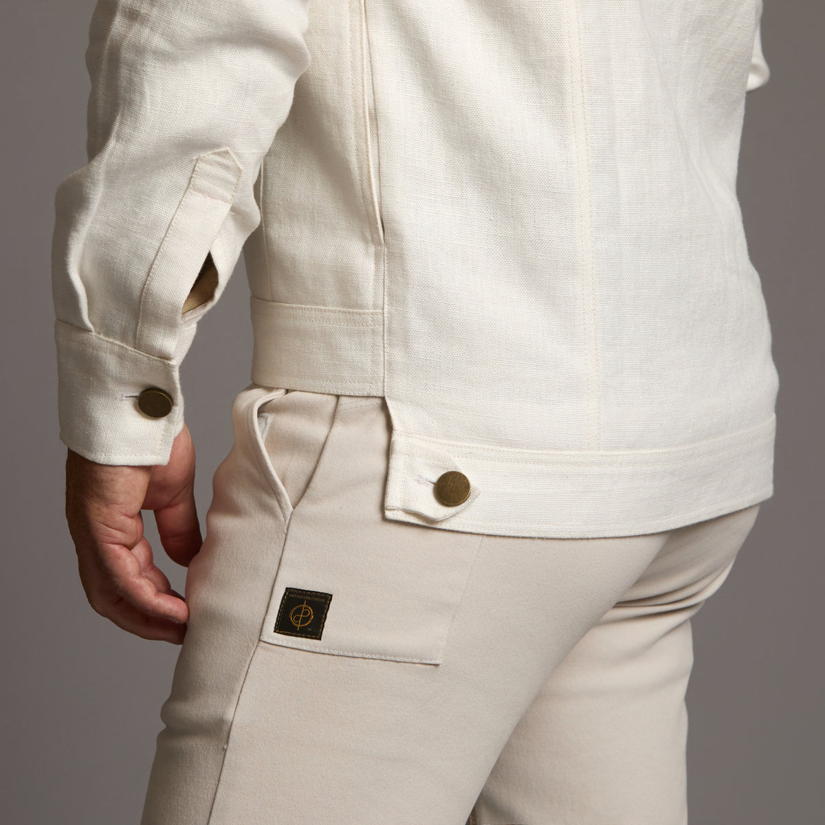 Male modeling white axis jacket