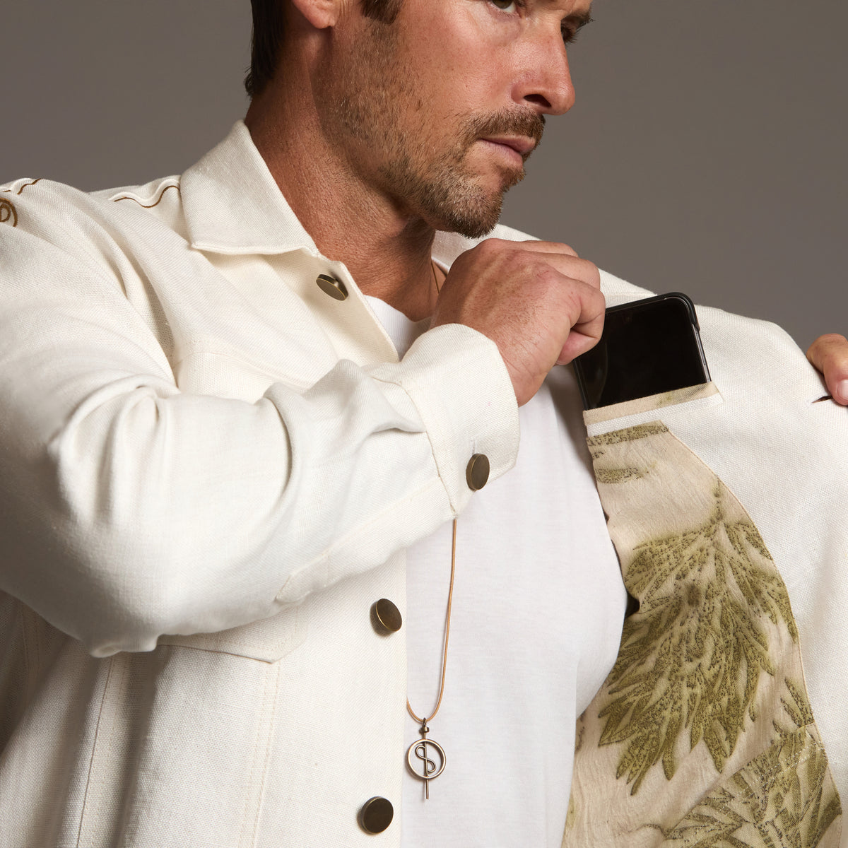 Male modeling white axis jacket