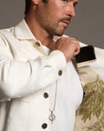 Male modeling white axis jacket