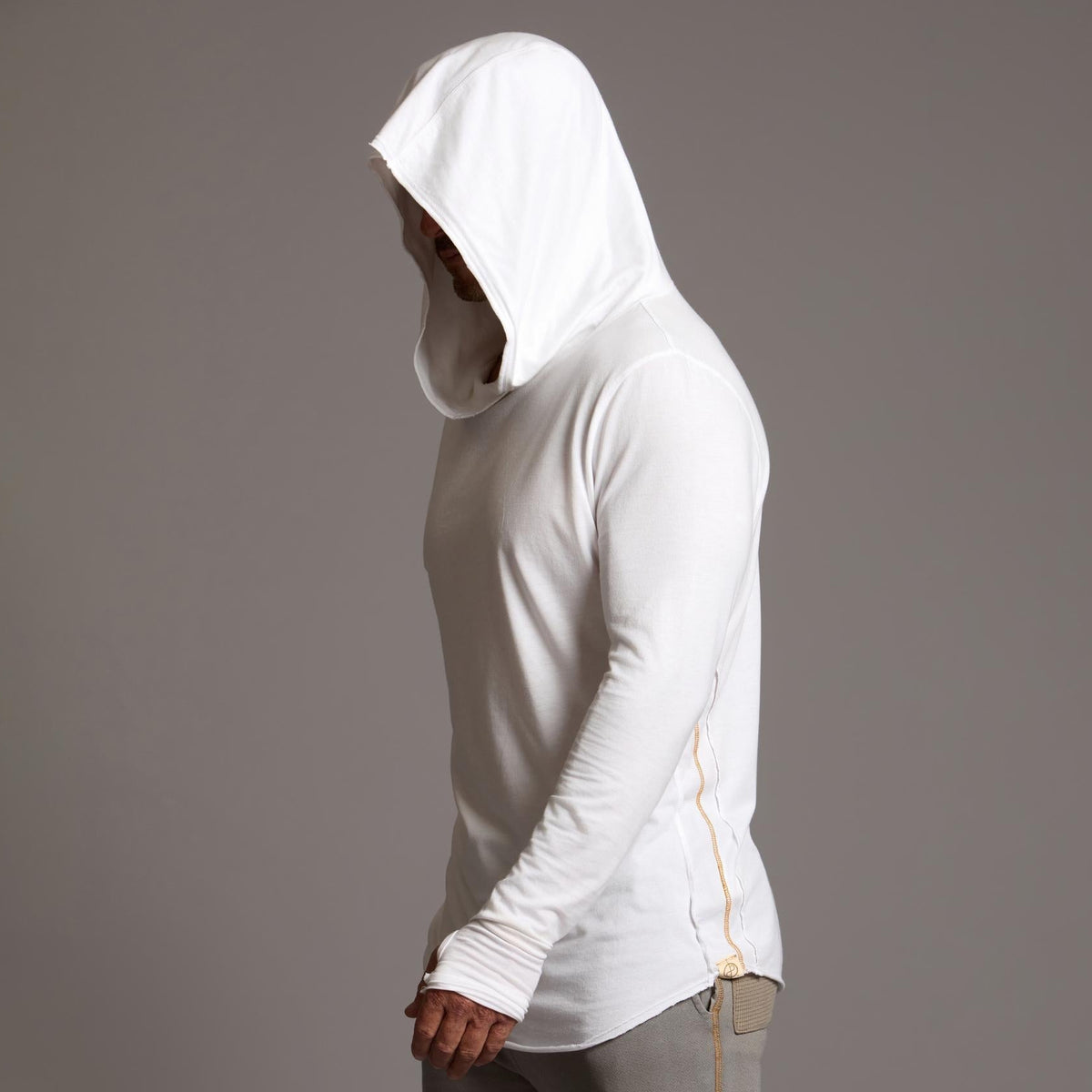 Man modeling white long-sleeve hooded tee