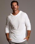 Man modeling white long-sleeve hooded tee