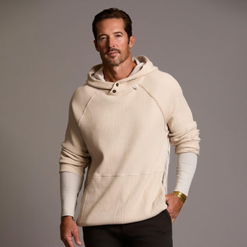 A man modeling a Oversized pullover shirt in white stone