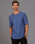 Male modeling blue crew neck shirt