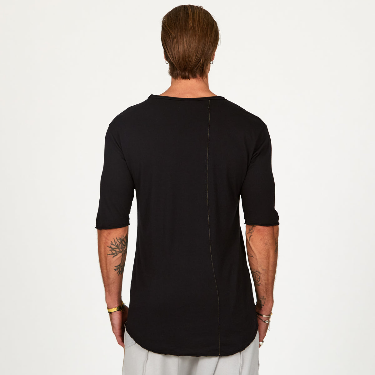 Male modeling black crew neck shirt 