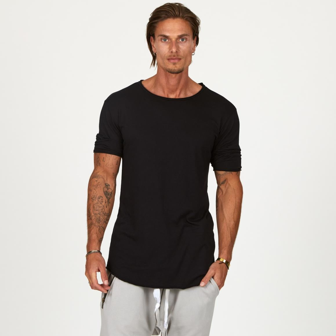Male modeling black crew neck shirt 