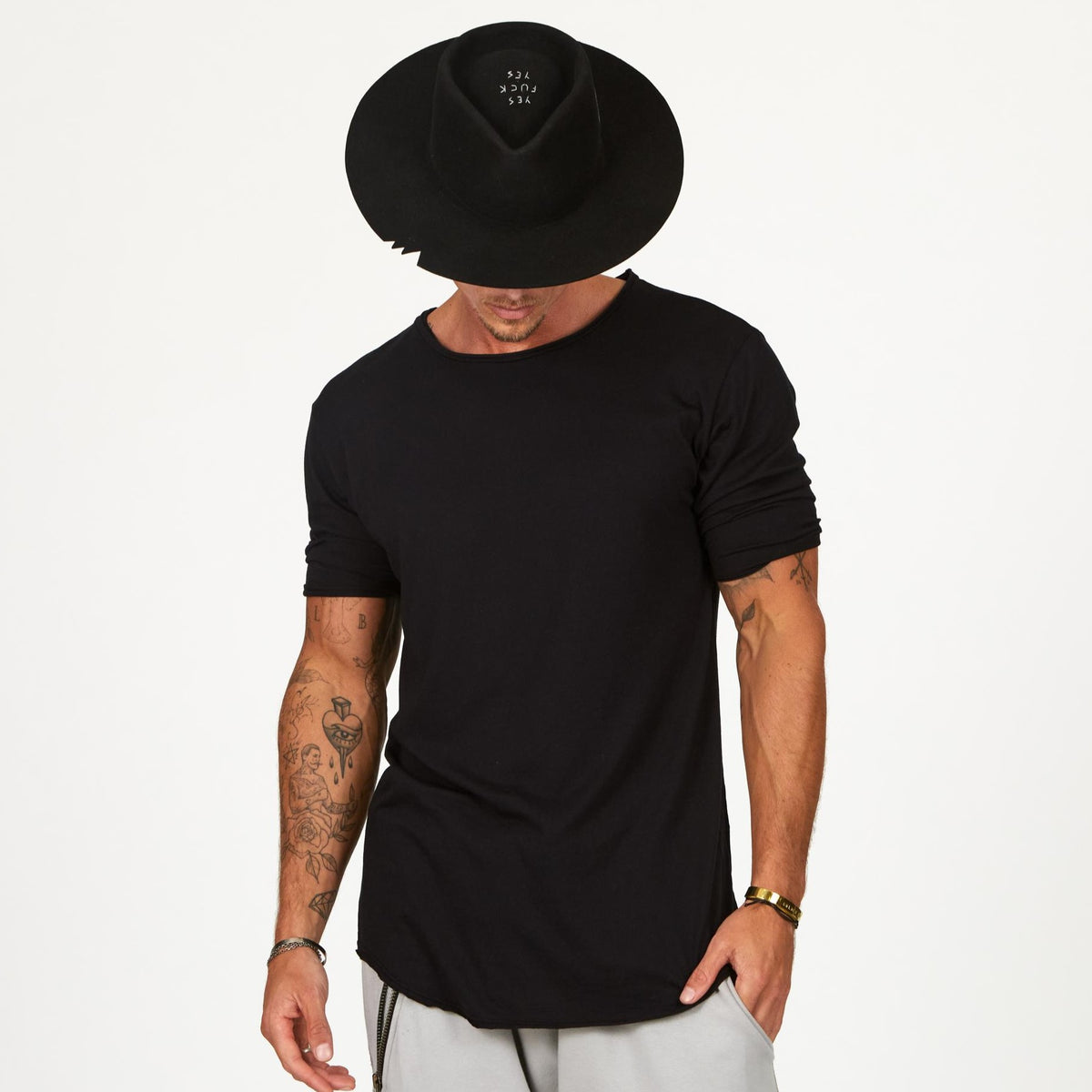 Male modeling black crew neck shirt 
