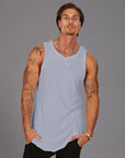 Man modeling a Clay blue tank top