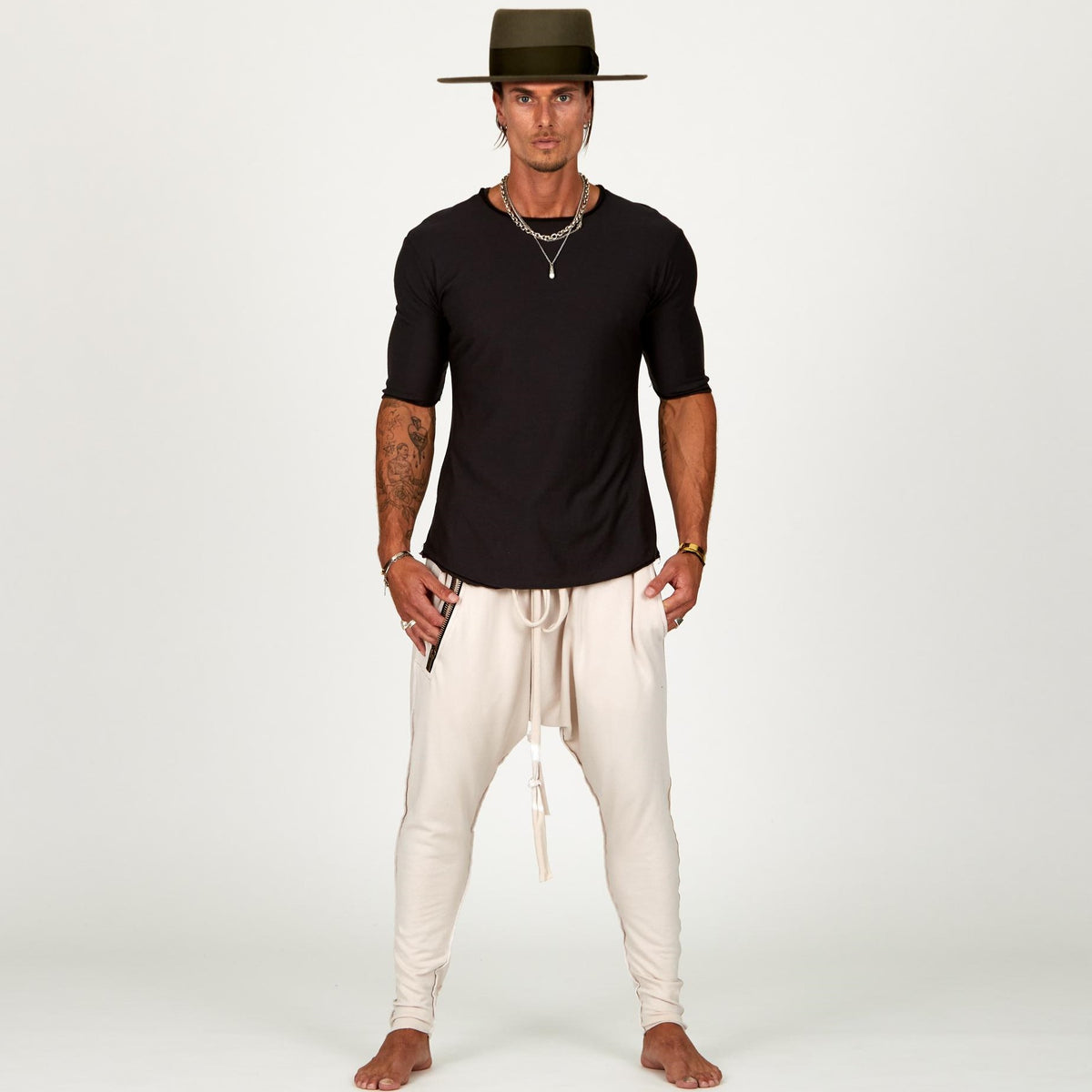Male modeling White Stone colored pants