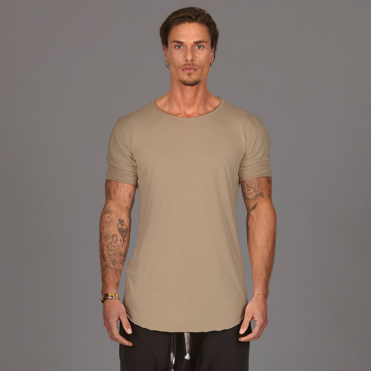 Male modeling tan crew neck shirt