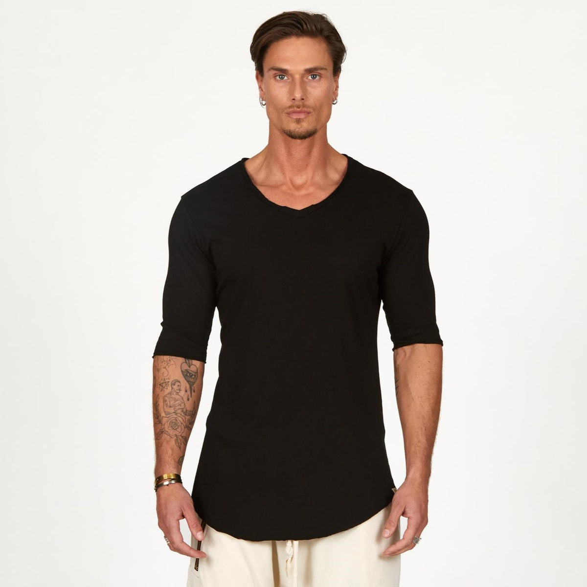 Male modeling black v neck shirt 