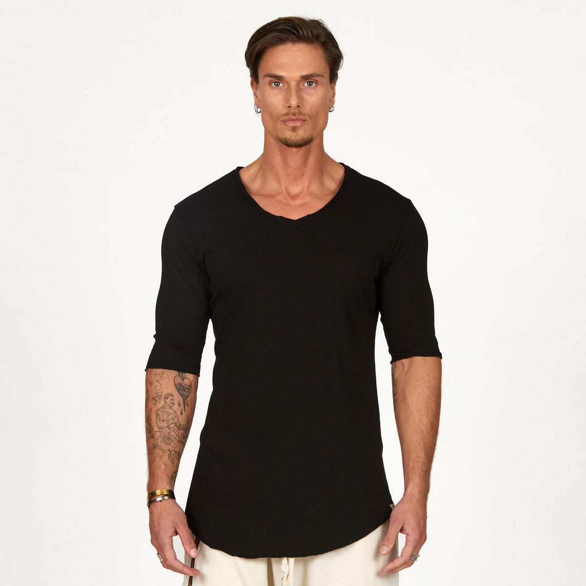 Male modeling black v neck shirt 