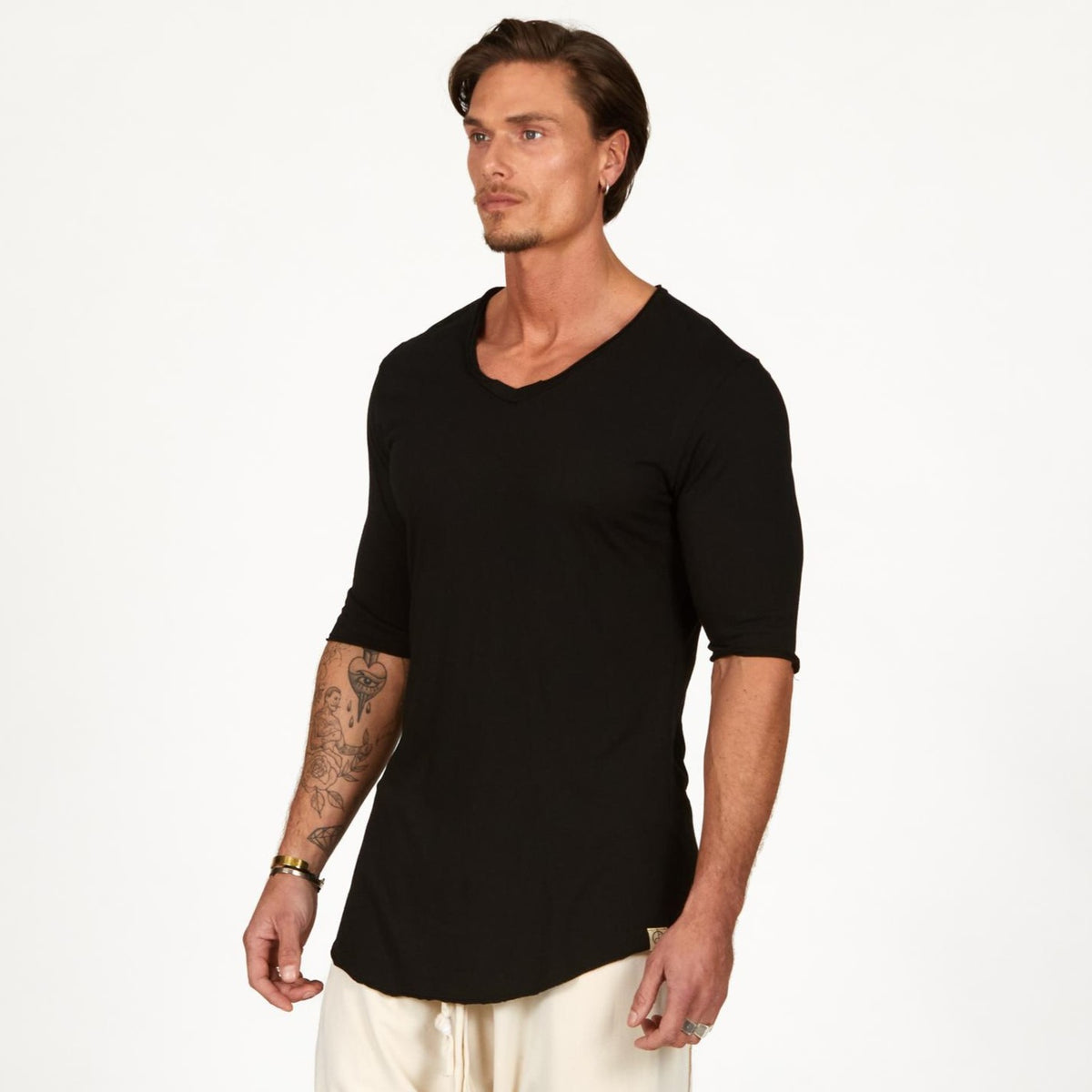 Male modeling black v neck shirt 