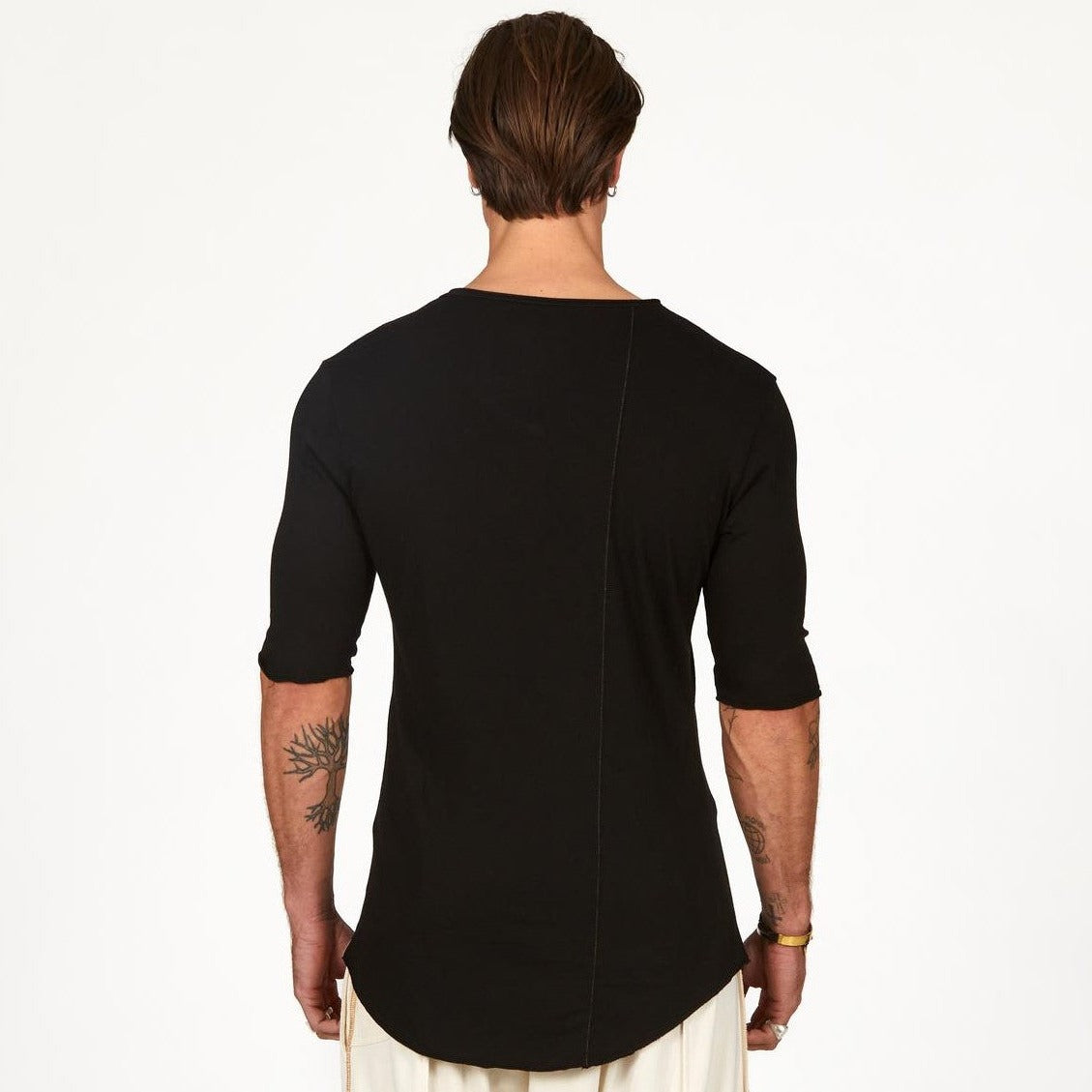 Man modeling a mid sleeve shirt in black