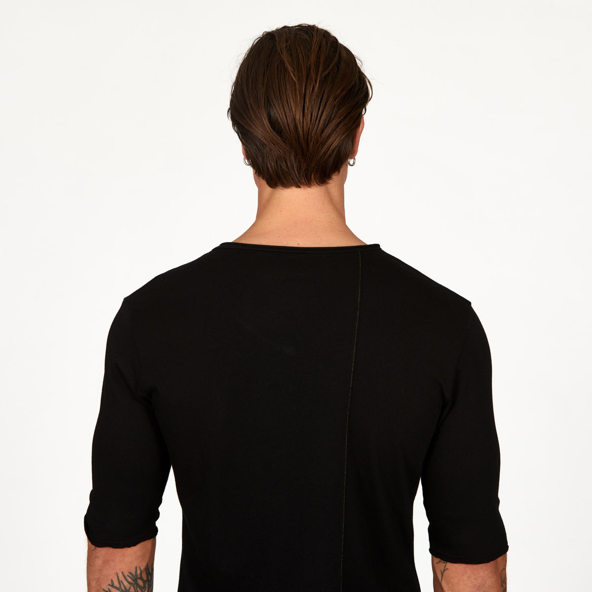 Male modeling black v neck shirt 