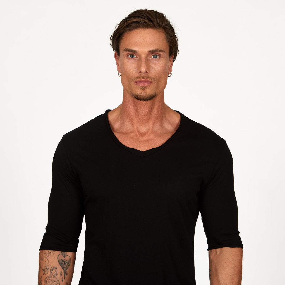 Man modeling a mid sleeve shirt in black