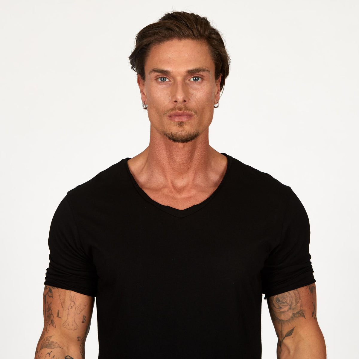 Man modeling a mid sleeve shirt in black