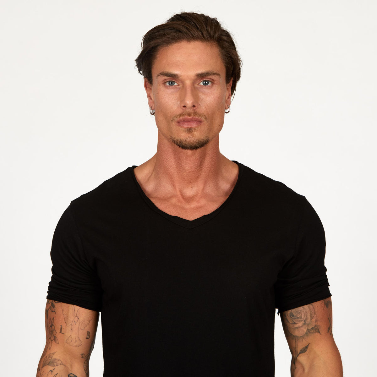 Male modeling black v neck shirt 
