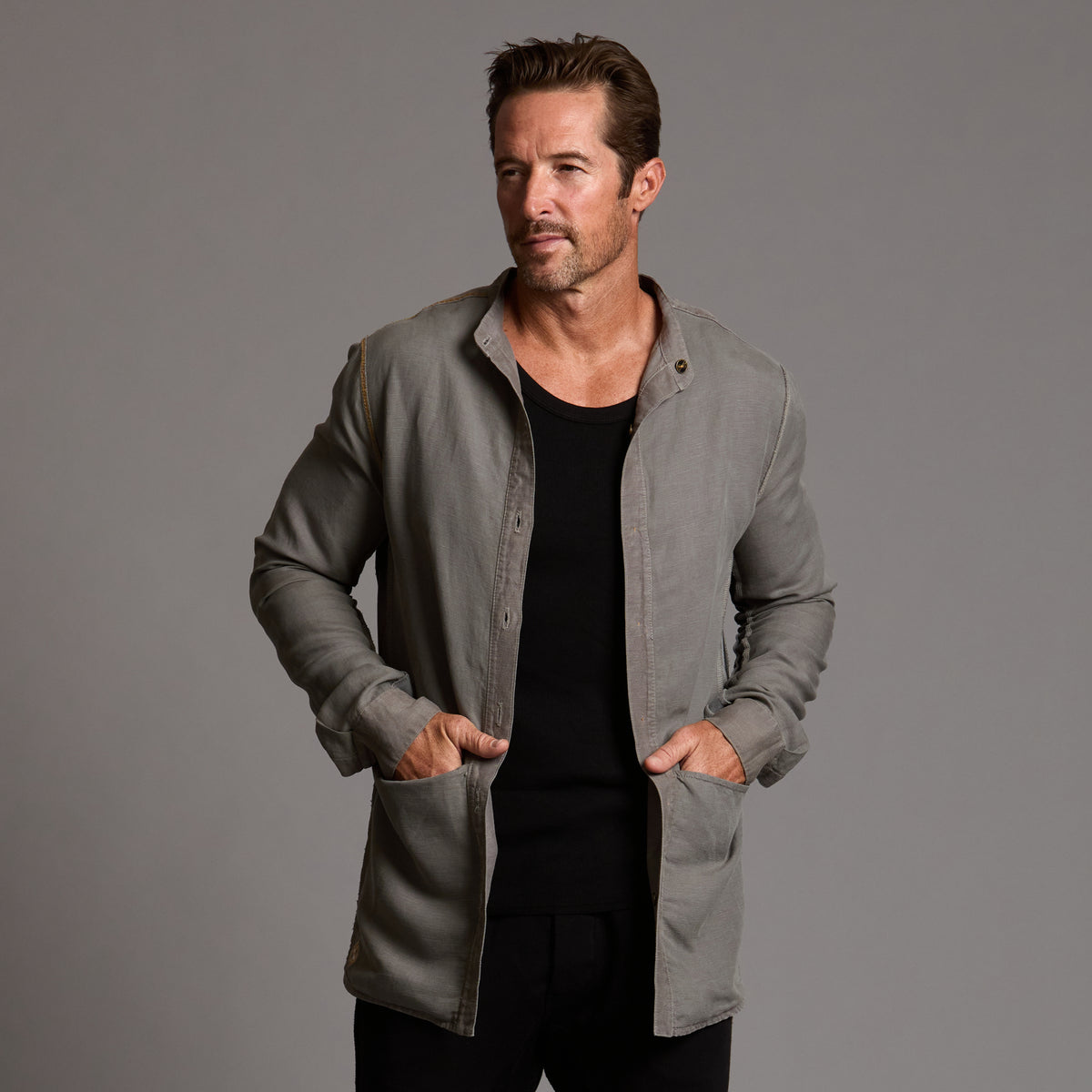 Male modeling Shacket in River Rock