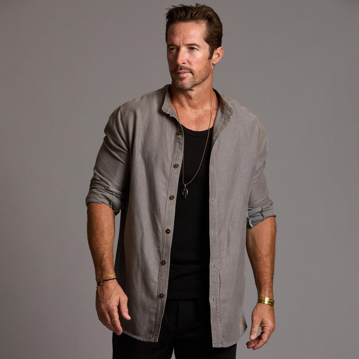 Male modeling Shacket in River Rock