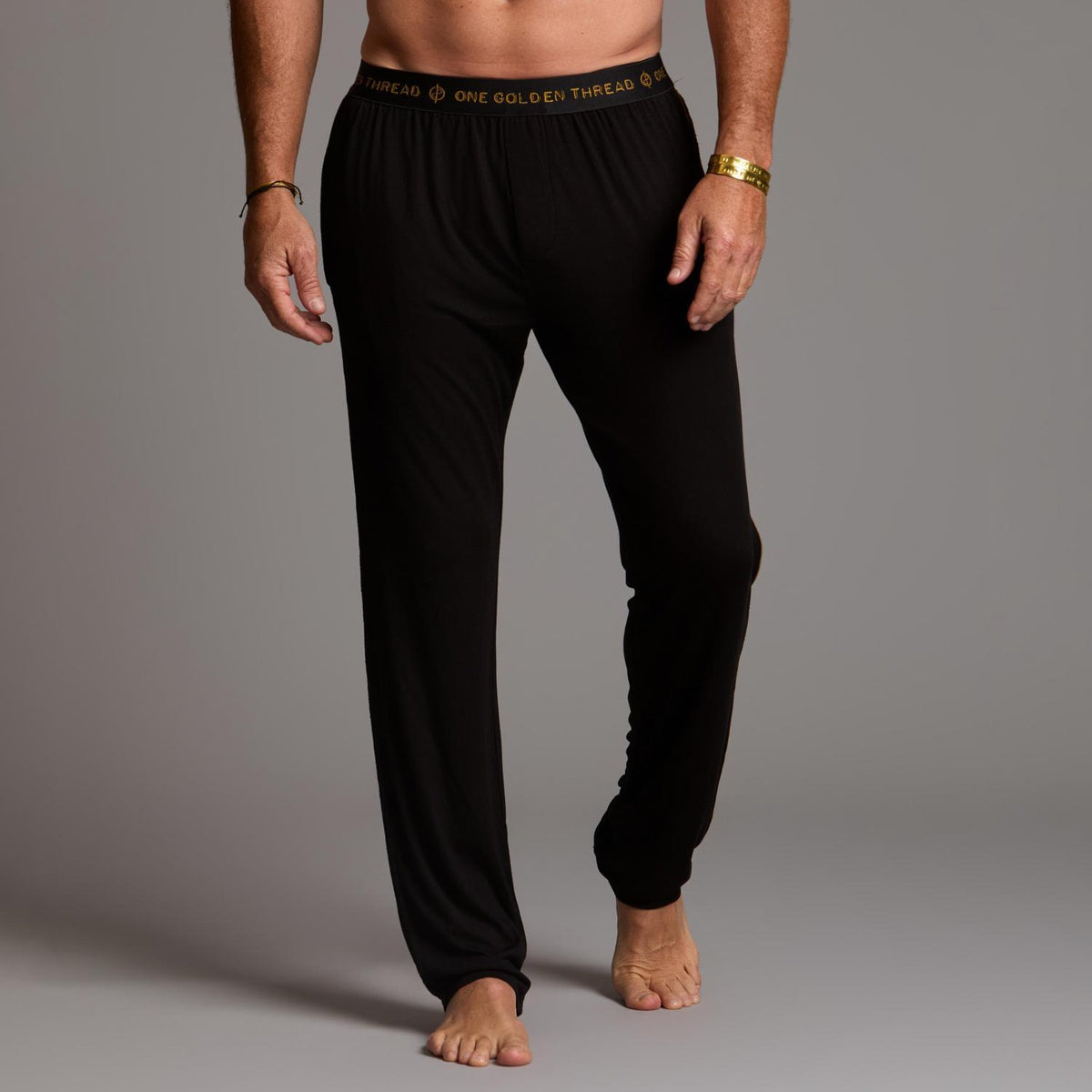 Male modeling the black tree silk pant