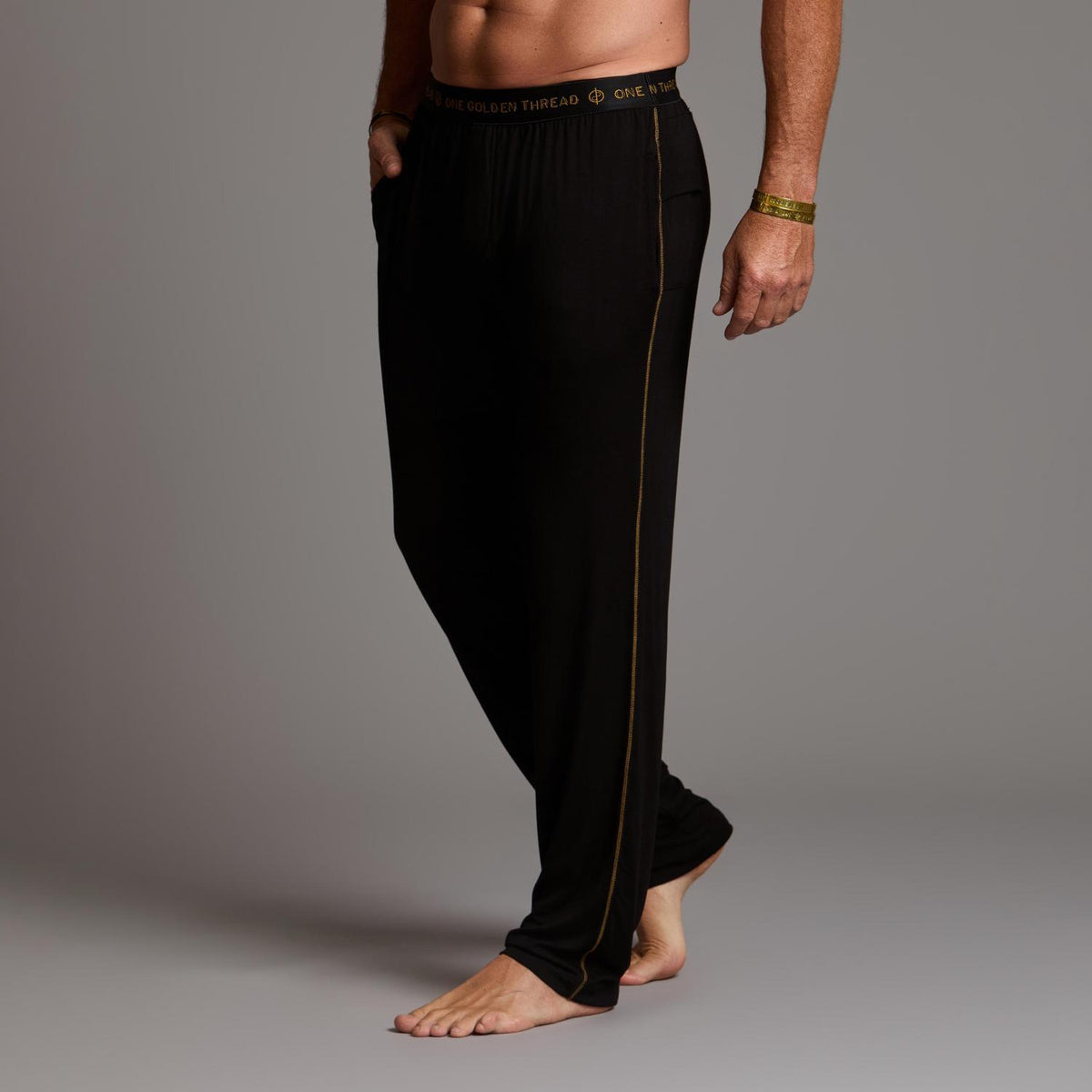 Male modeling the black tree silk pant