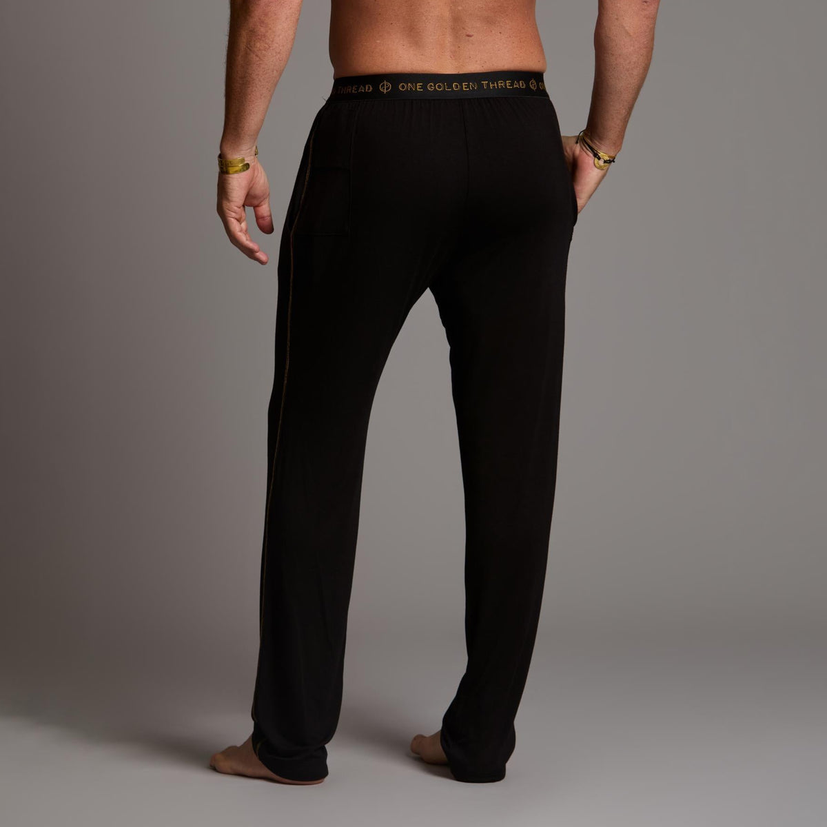 Male modeling the black tree silk pant