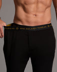 Male modeling the black tree silk pant