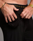 Male modeling the black tree silk pant