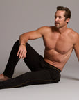 Male modeling the black tree silk pant