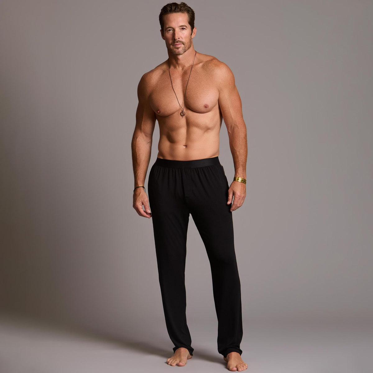 Male modeling the black tree silk pant