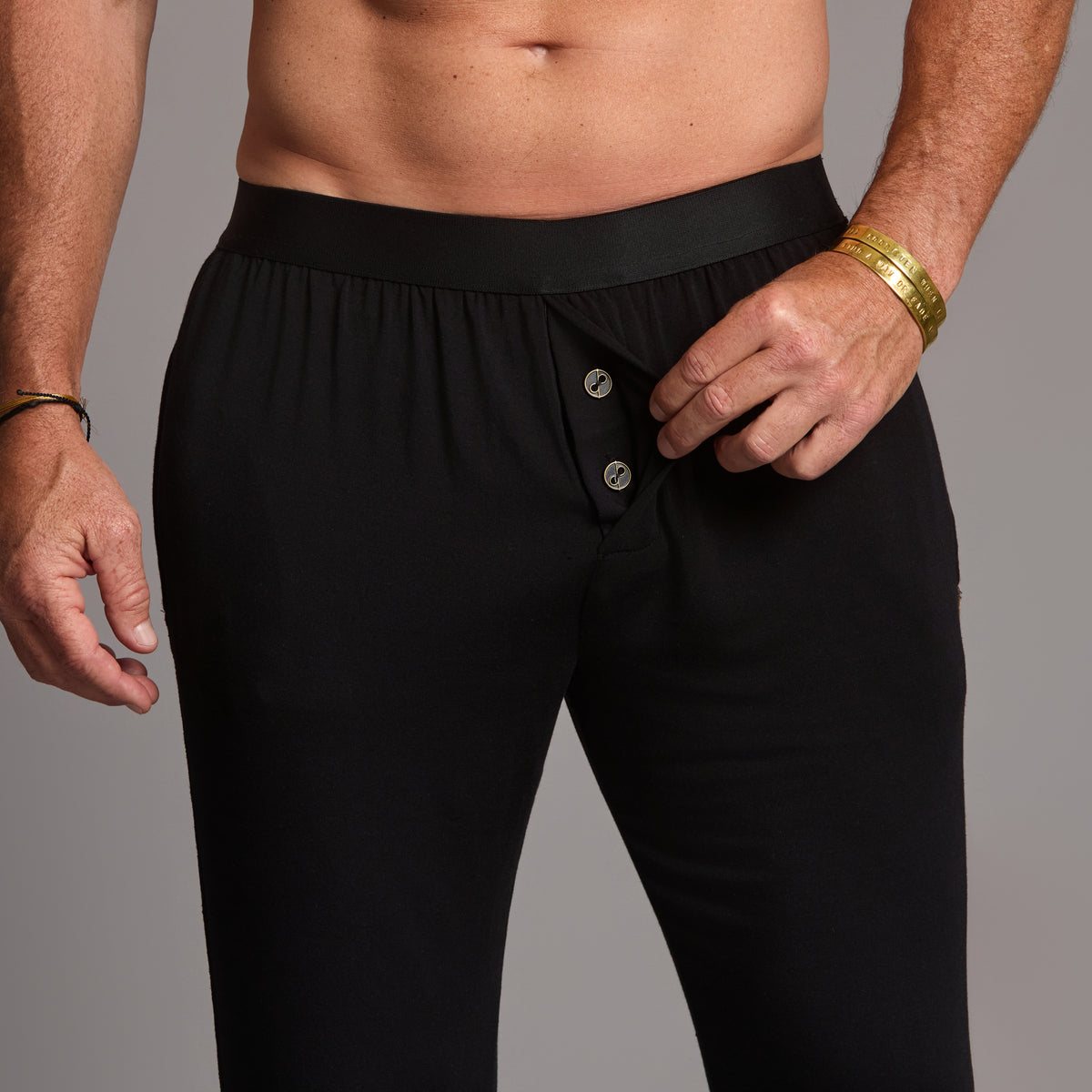 Male modeling the black tree silk pant