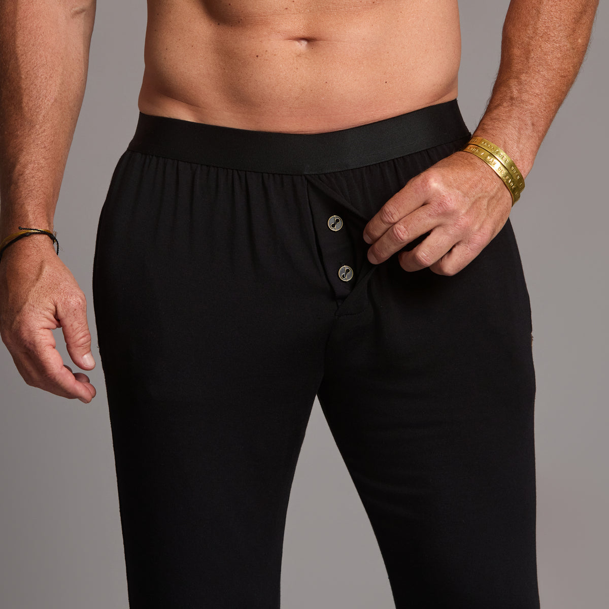 Male modeling the black tree silk pant