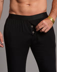 Male modeling the black tree silk pant