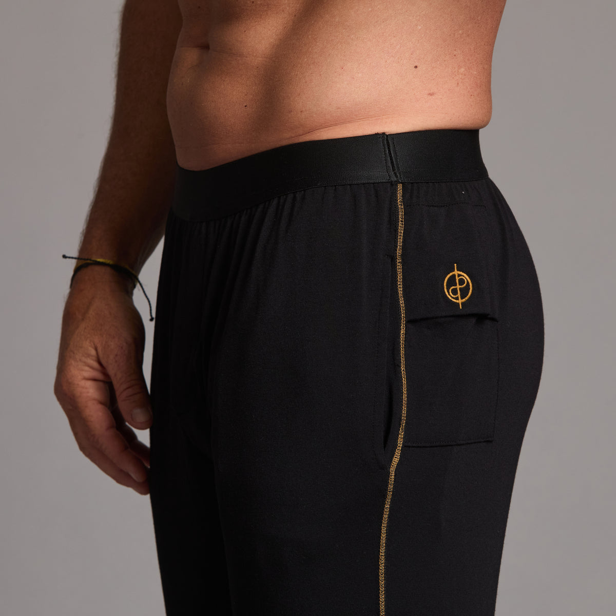 Male modeling the black tree silk pant