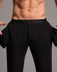 Male modeling the black tree silk pant