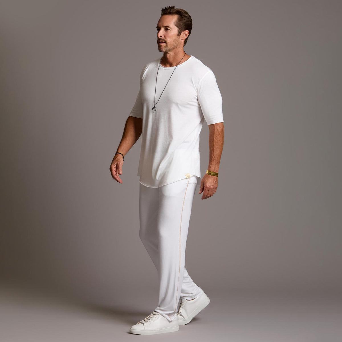Male modeling the white tree silk pant
